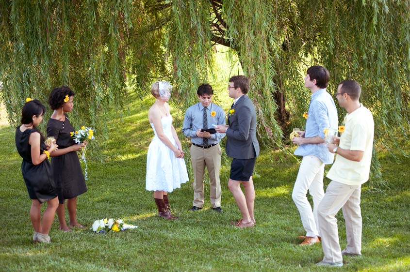 Illinois outdoor wedding under willow tree grooms is wearing shorts