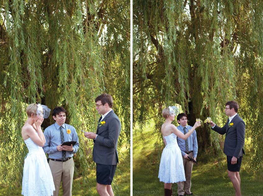 outdoor wedding under willow tree Bride and groom drinking wine from the